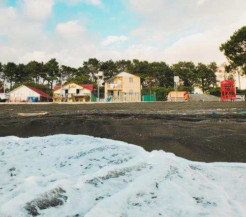 a pile of snow in front of a playground at Ureki House in Ureki