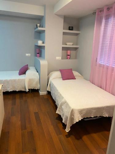 Ένα ή περισσότερα κρεβάτια σε δωμάτιο στο CASA TRES HERMANOS