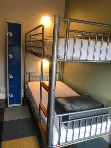 a bunk bed room with two bunk beds in it at Newcastle House Rothbury in Rothbury