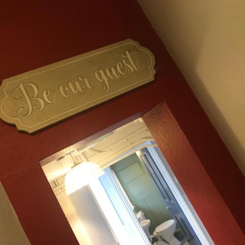a sign that says be civil counsel hanging above a window at Newcastle House Rothbury in Rothbury