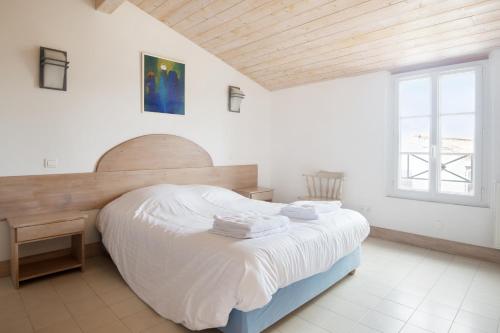 Säng eller sängar i ett rum på Maison Campanule