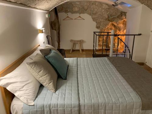 מיטה או מיטות בחדר ב-Aurora Medieval House