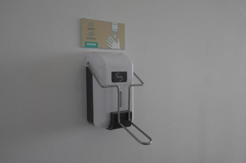 a paper towel dispenser attached to a wall at Ocean View Suite in Paço de Arcos