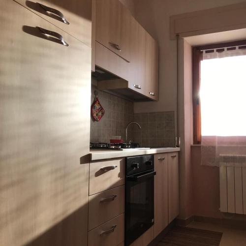 a kitchen with a stove and a sink at Agriturismo La Rosa Spina in Fivizzano