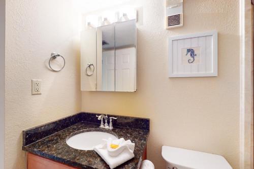 a bathroom with a sink and a toilet at Islander Condominiums I in Fort Walton Beach