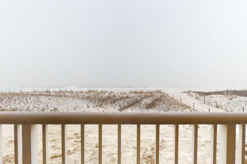 a view of a beach from a balcony at Islander Condominiums I in Fort Walton Beach