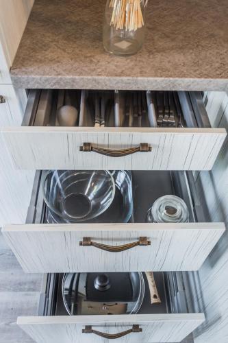 an open kitchen drawer with a sink in it at Evita - 'Virš Ąžuolų' - Forest SPA - Horses - Lake in Paplatelė