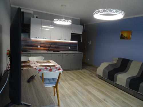 Χώρος καθιστικού στο Porta Mare Apartamenty Słoneczne Tarasy