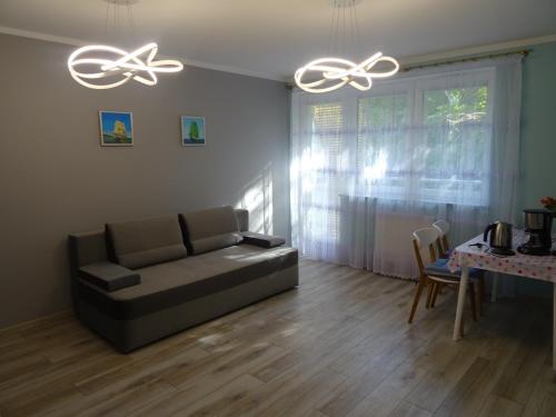 Χώρος καθιστικού στο Porta Mare Apartamenty Słoneczne Tarasy