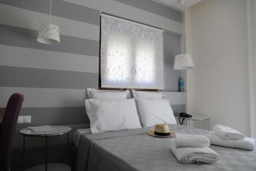 Postel nebo postele na pokoji v ubytování Dimitra Boutique Hotel