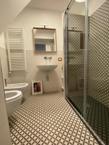 a bathroom with a shower and a sink and a toilet at Carruggio 151-2 in Sestri Levante