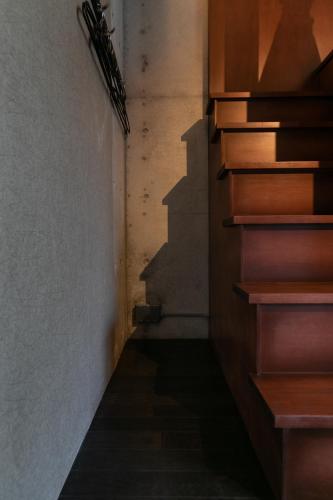 a hallway with stairs in a building at Creare Ryogoku in Tokyo