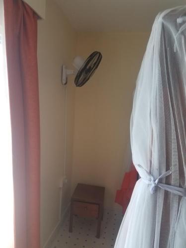 a wedding dress is hanging in a room at Ocean View Nyali Boutique Hotel in Nyali