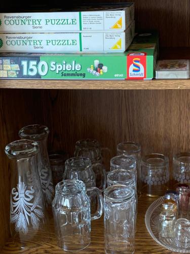 a bunch of glass mason jars sitting on a shelf at Ferienwohnung Paulina in Braunschweig