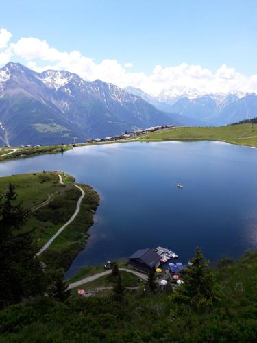 a view of a lake with mountains in the background at Chalet-Schümli Maisonette in Ernen
