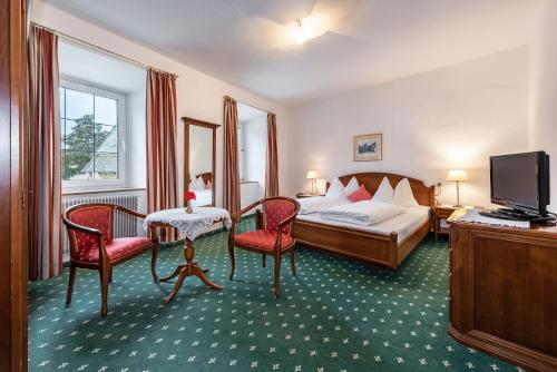 Postel nebo postele na pokoji v ubytování Hotel Weisse Lilie - B&B