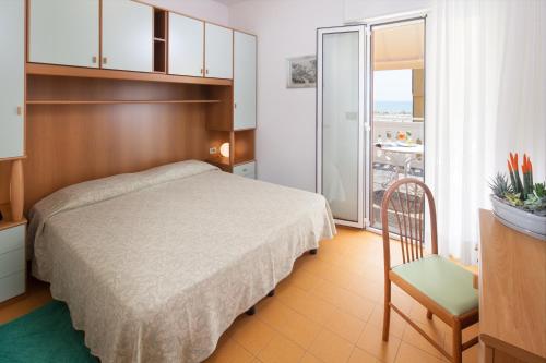 Postel nebo postele na pokoji v ubytování Hotel Universal