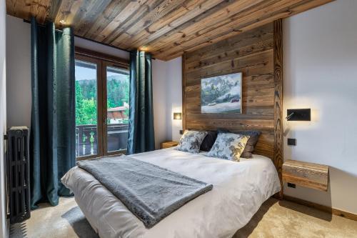Ένα ή περισσότερα κρεβάτια σε δωμάτιο στο MEGEVE Jaillet 3 chambres 6 personnes