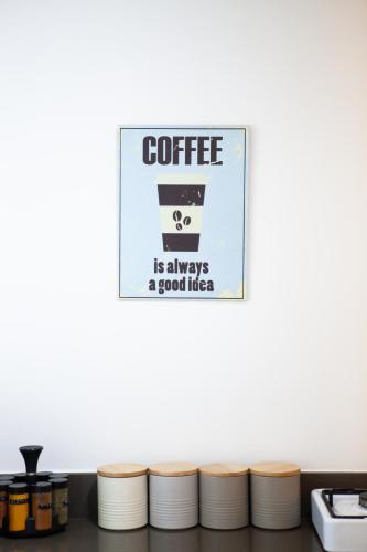 a sign that reads coffee is always a good idea at Olive - Israeli Zimmer in Bet Hillel