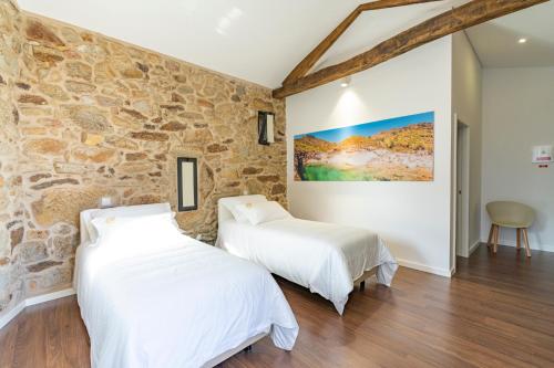 Ένα ή περισσότερα κρεβάτια σε δωμάτιο στο GOLDNATURE