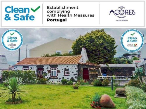 una foto de una casa con el logo limpio y seguro en Fisherman's House Azores, en Angra do Heroísmo