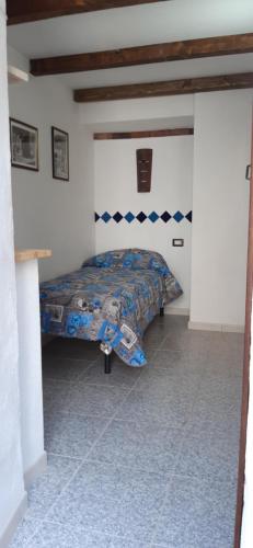 a bedroom with a bed in a room at B&b barbaricino iun F1442 in Oliena