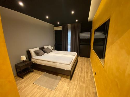 a bedroom with a bed and two bunk beds at Motel Stari Hrast in Markovac