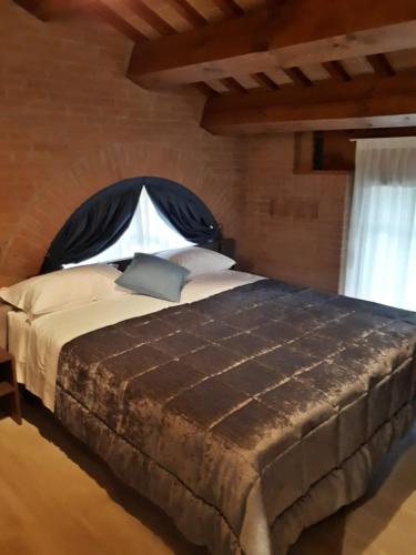 Ένα ή περισσότερα κρεβάτια σε δωμάτιο στο Agriturismo Cabrele
