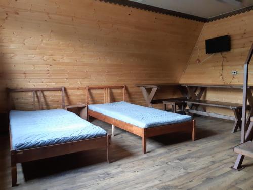 Кровать или кровати в номере Hotel Dolina Uyuta