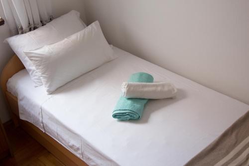 Postel nebo postele na pokoji v ubytování Krajcer Apartments