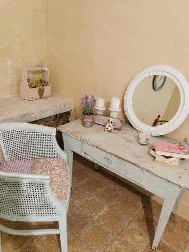 a dressing table with a mirror and a chair at Holiday House Prodromos in Prodromos