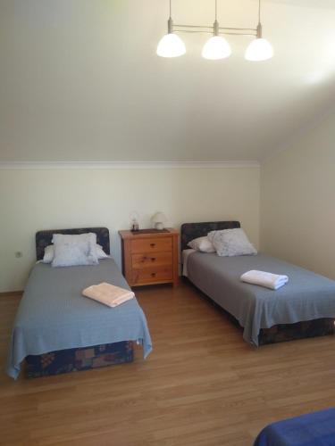 Postel nebo postele na pokoji v ubytování Planika Apartments 1