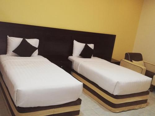 Postel nebo postele na pokoji v ubytování Alsafa Hotel