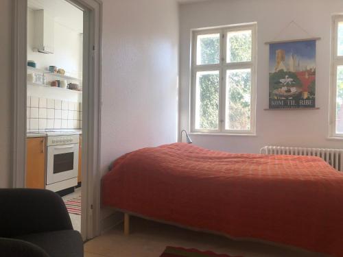 Postel nebo postele na pokoji v ubytování Lejlighed i hjertet af Ribe