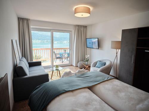 Posteľ alebo postele v izbe v ubytovaní SEE Moment Appartements ADULTS ONLY
