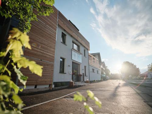 a building on the side of a street at SEE Moment Appartements ADULTS ONLY in St. Wolfgang