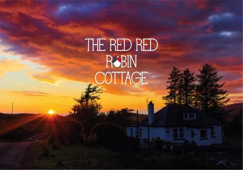 a sunset with a house and the red red raisin coffee at The Red Red Robin Cottage in Portree