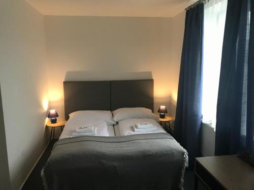 Postel nebo postele na pokoji v ubytování Garni G Hotel Žilina