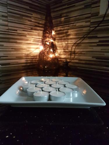 a white keyboard on a table with a christmas tree in the background at Dar Doudi in Sousse