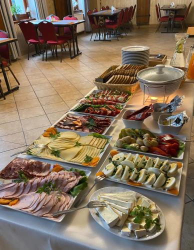 a buffet with many different types of food on a table at Hotel i Restauracja Castle in Bystrzyca Kłodzka