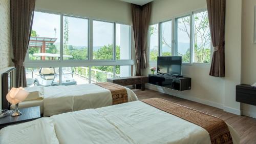 Katil atau katil-katil dalam bilik di Ravin Home ราวินโฮม