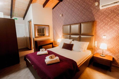 Postel nebo postele na pokoji v ubytování Hotel Torini