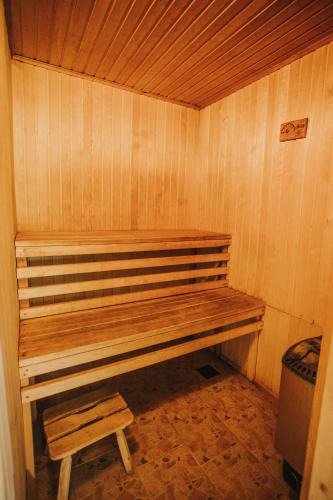 a wooden bench sitting in a sauna at Guest House Baltās Dūjas in Saulkrasti