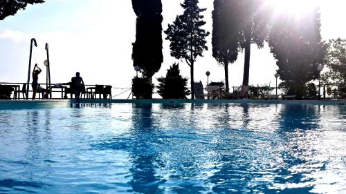 a large body of water surrounded by trees at Camping Village Panoramico Fiesole in Fiesole
