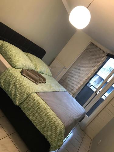 a bedroom with a bed with a lamp and a window at Dream Apartment Wiesbaden City Balkon RHEIN MAIN CONGRESS CENTER in Wiesbaden