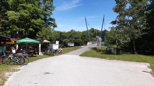 a road leading to a market with bikes on the side at Apartma na hüti in Radenci