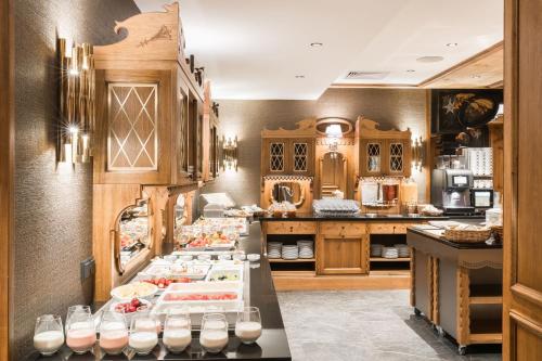 a kitchen with a buffet of food on display at Hotel Wersal in Zakopane