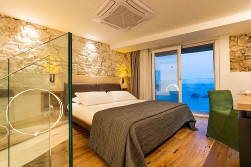 Ένα ή περισσότερα κρεβάτια σε δωμάτιο στο Re Dionisio Luxury Suites