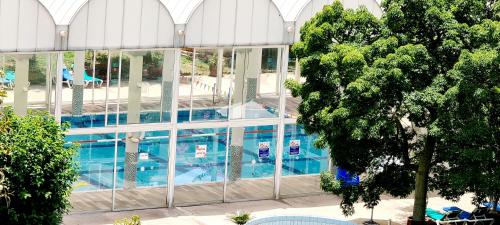 an overhead view of a building with a swimming pool at Royal Suite Caesarea in Caesarea