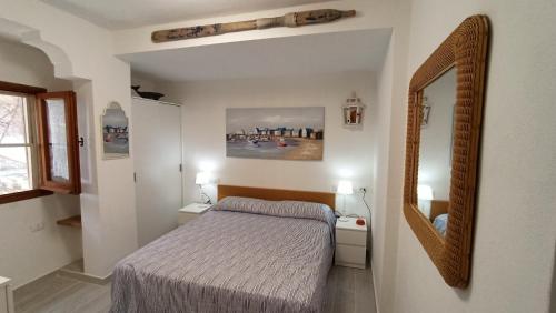 Un pat sau paturi într-o cameră la Villino Corallo Roby